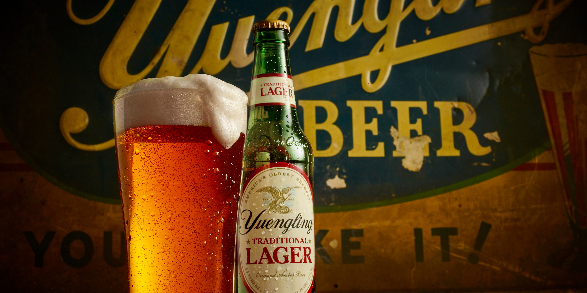 Bailey brand Consulting Yuengling beer traditional lager bottle and glass with moody lighting